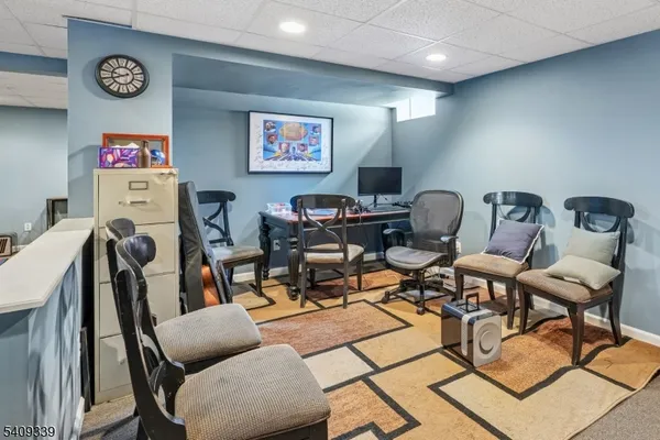 a work room with furniture and wooden floor
