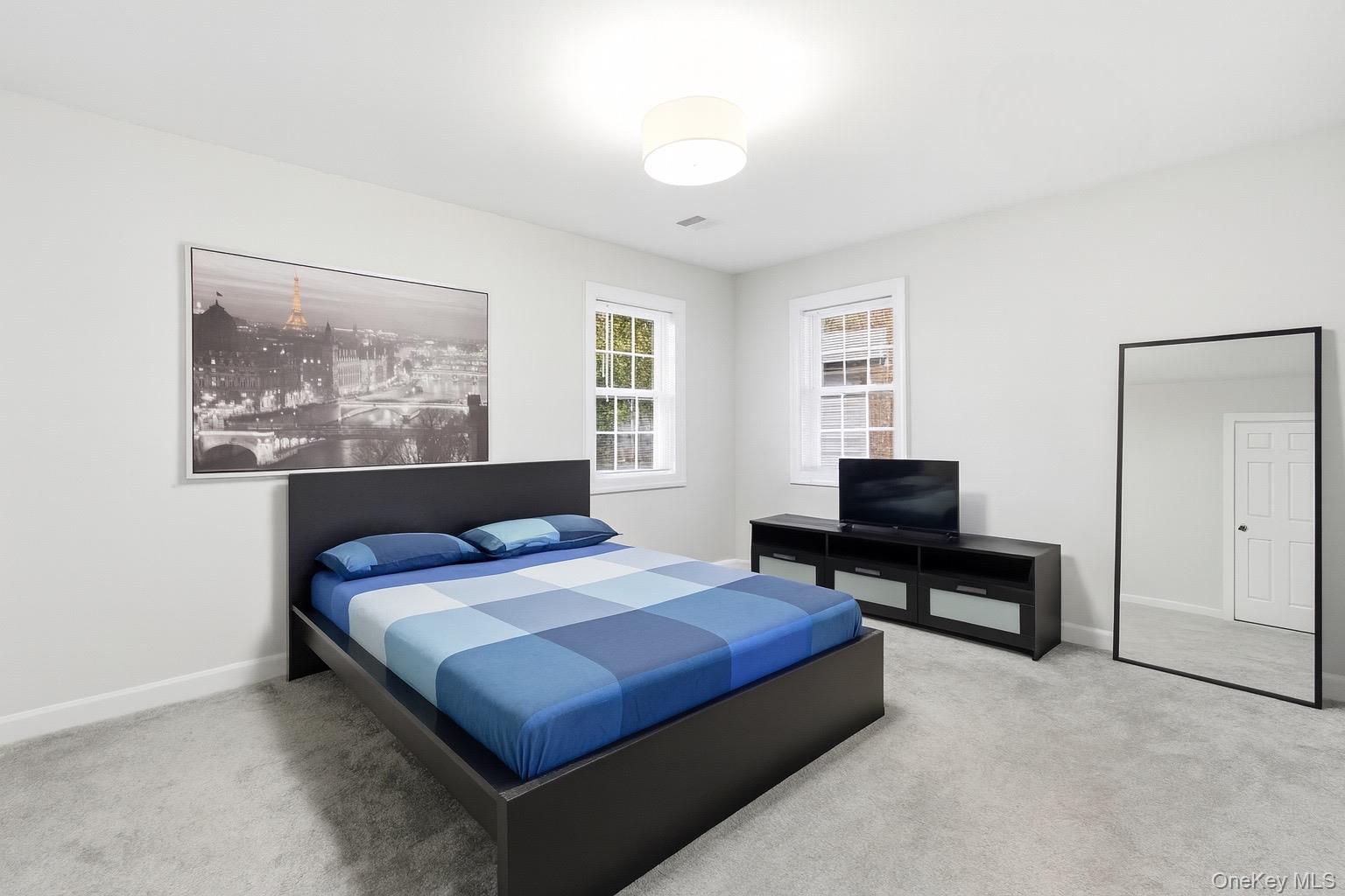 130 Beaver Dam Road Brookhaven, NY 11719 - Photo 13 of 15 a bedroom with a bed and a window