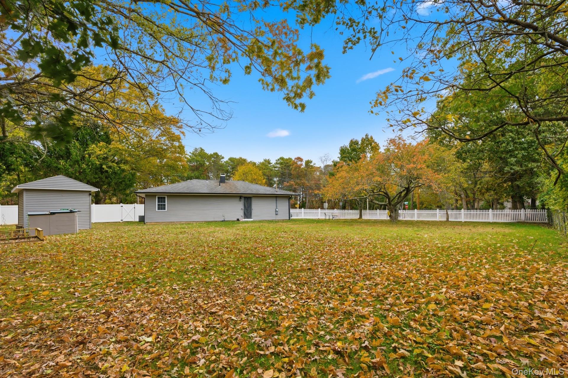 130 Beaver Dam Road Brookhaven, NY 11719 - Photo 2 of 15 a view of a house with a yard
