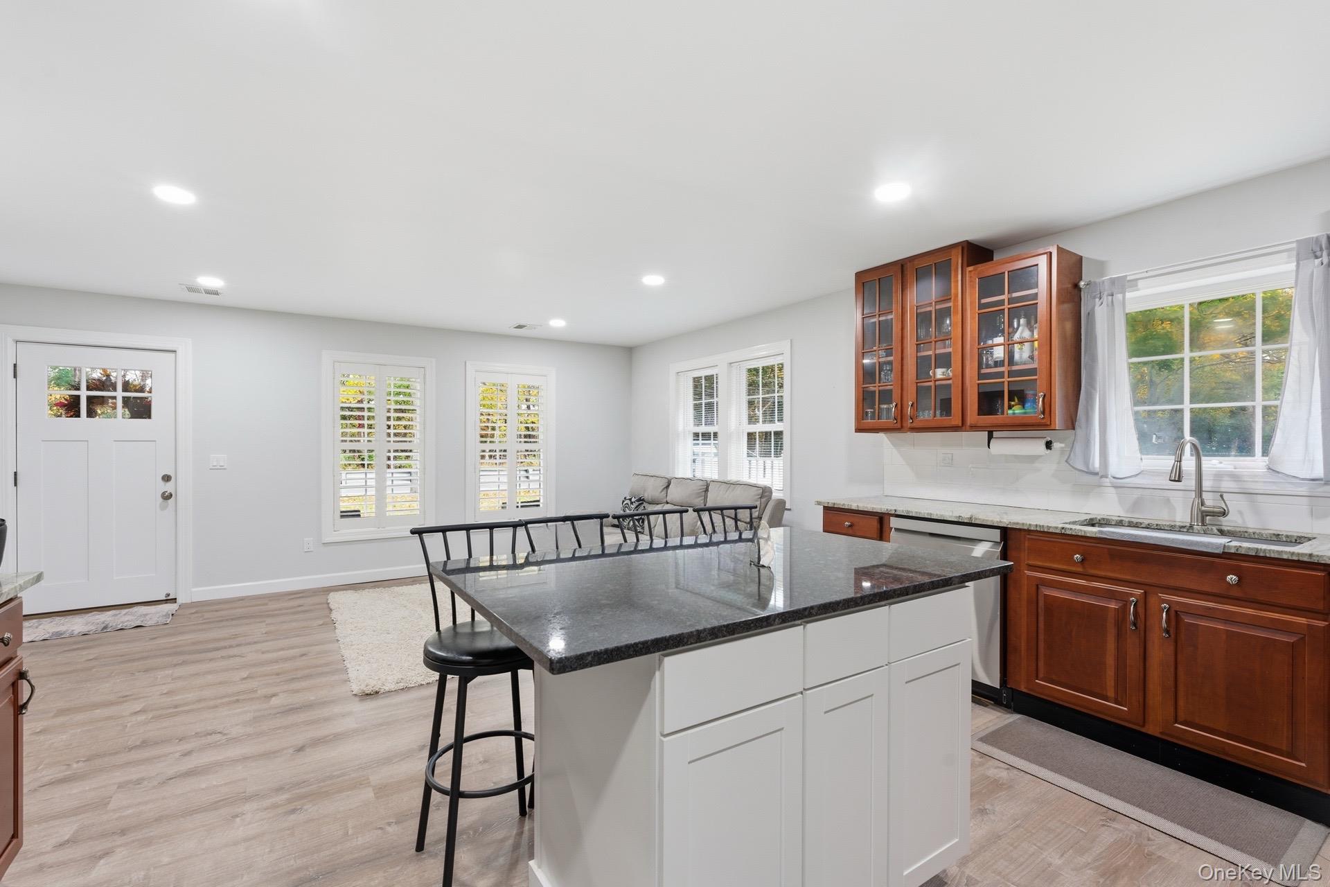 130 Beaver Dam Road Brookhaven, NY 11719 - Photo 5 of 15 a kitchen with granite countertop a sink and cabinets