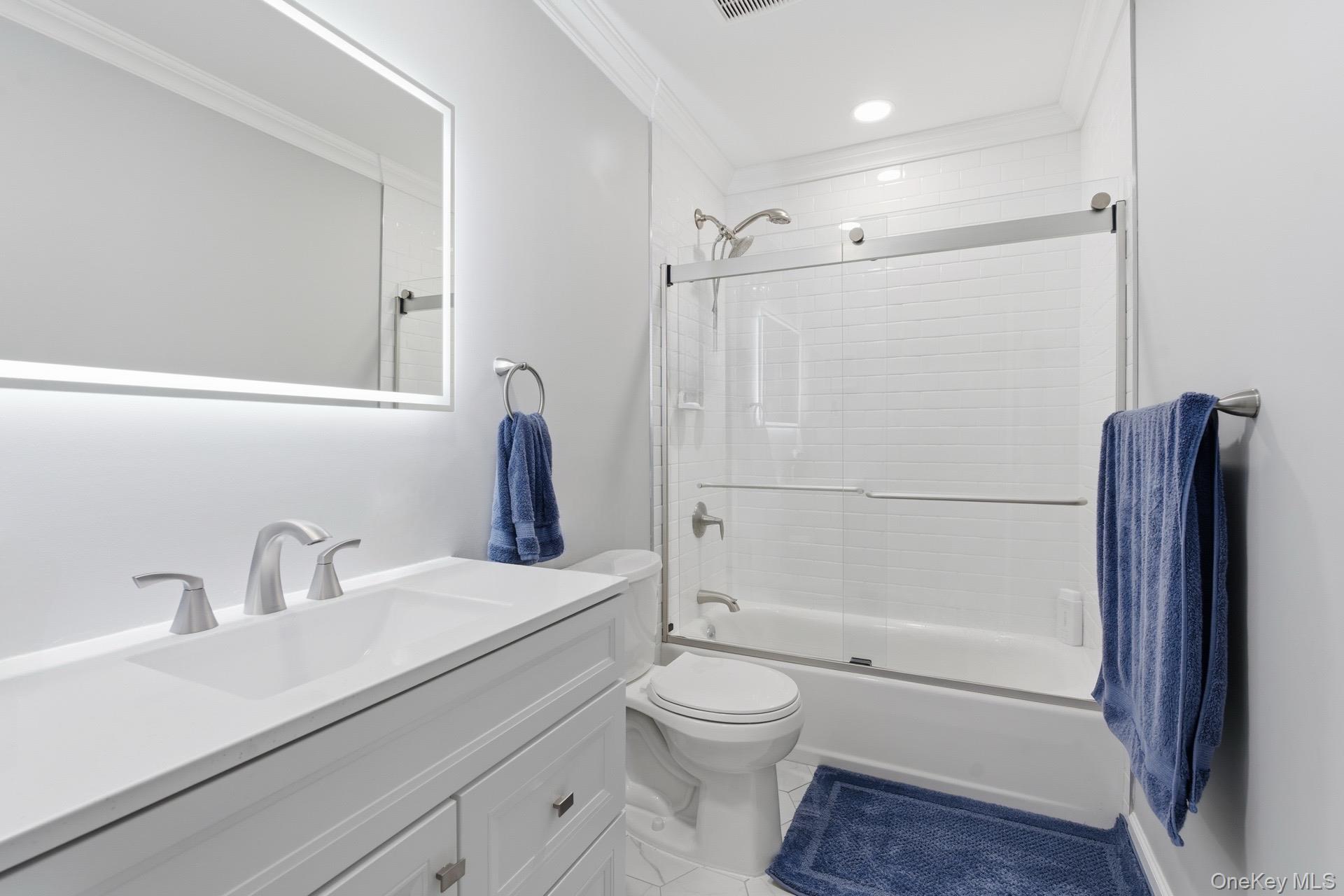 130 Beaver Dam Road Brookhaven, NY 11719 - Photo 8 of 15 a bathroom with a sink a toilet and shower