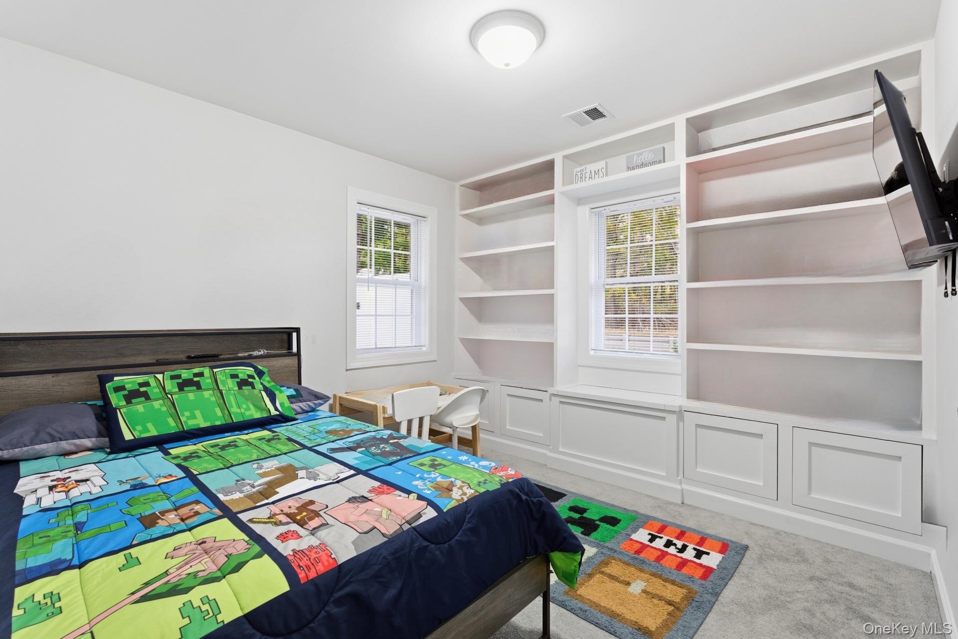 130 Beaver Dam Road Brookhaven, NY 11719 - Photo 10 of 15 a bedroom with a bed and a window