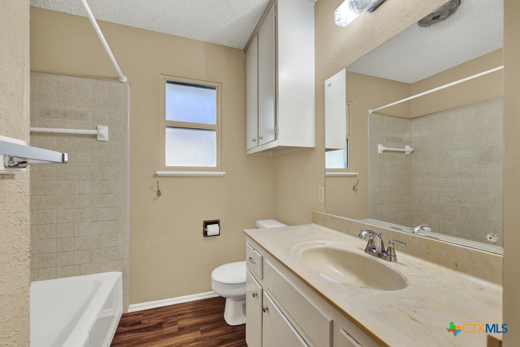 217 Gruene Road New Braunfels, TX 78130 - Photo 16 of 25 a bathroom with a sink toilet and shower