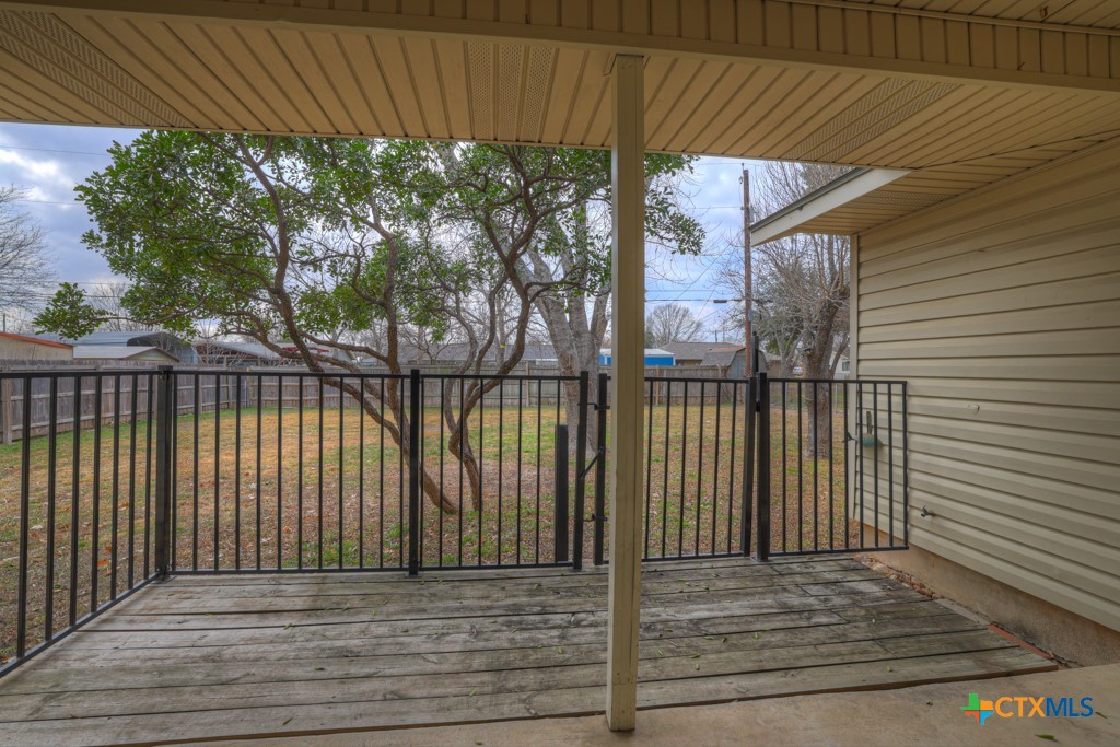 217 Gruene Road New Braunfels, TX 78130 - Photo 19 of 25 a view of backyard with wooden fence and large trees