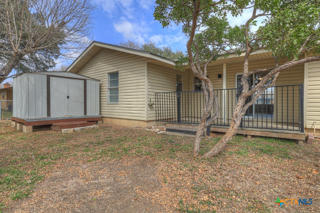 217 Gruene Road New Braunfels, TX 78130 - Photo 23 of 25 a backyard of a house with stairs and a large tree