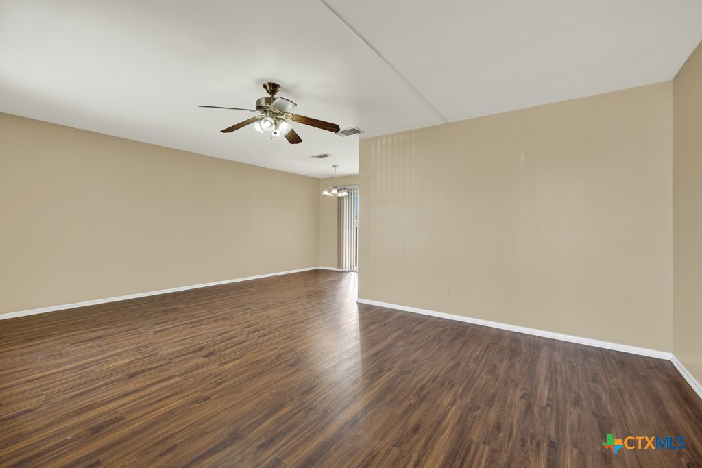 217 Gruene Road New Braunfels, TX 78130 - Photo 5 of 25 a view of a room with wooden floor ceiling fan