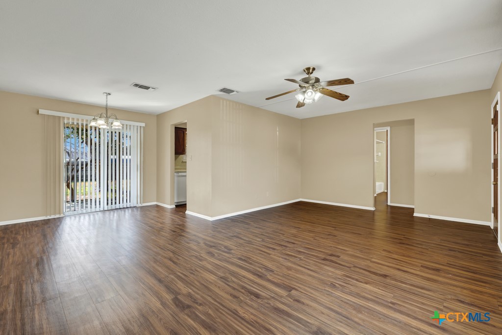 217 Gruene Road New Braunfels, TX 78130 - Photo 7 of 25 a view of empty room with wooden floor and fan