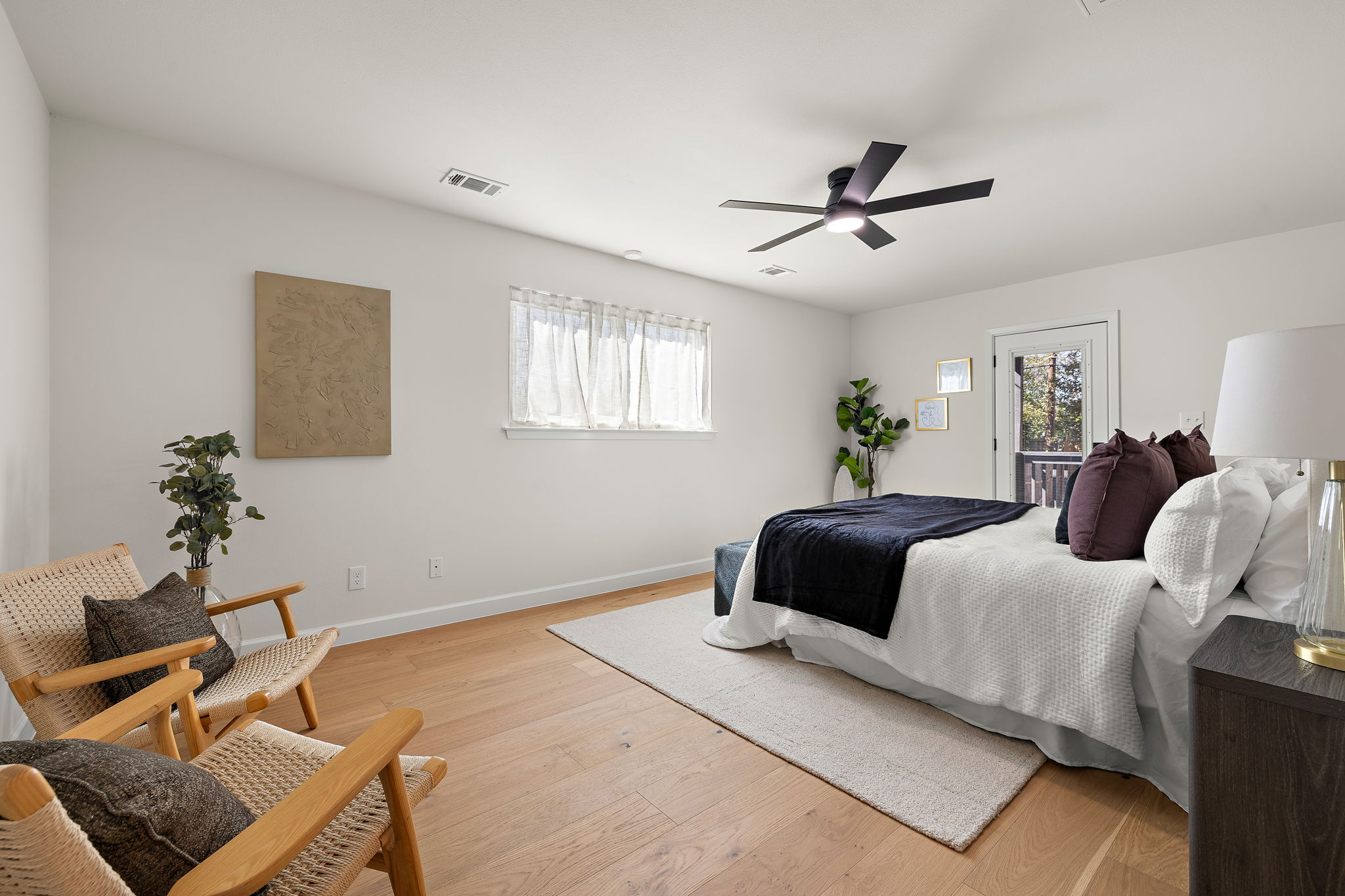 8102 Burrell Drive Austin, TX 78757 - Photo 18 of 35 a bedroom with a bed and wooden floor