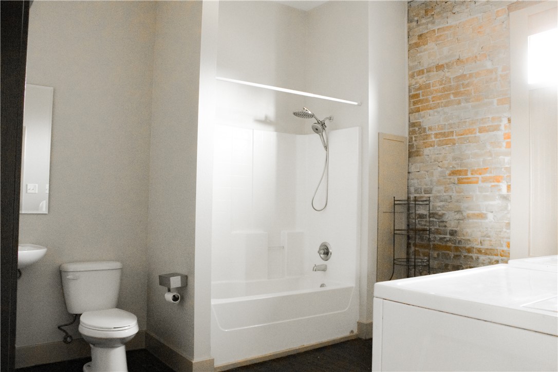 205 South Main Street Caldwell, TX 77836 - Photo 12 of 12 a bathroom with a toilet and a shower