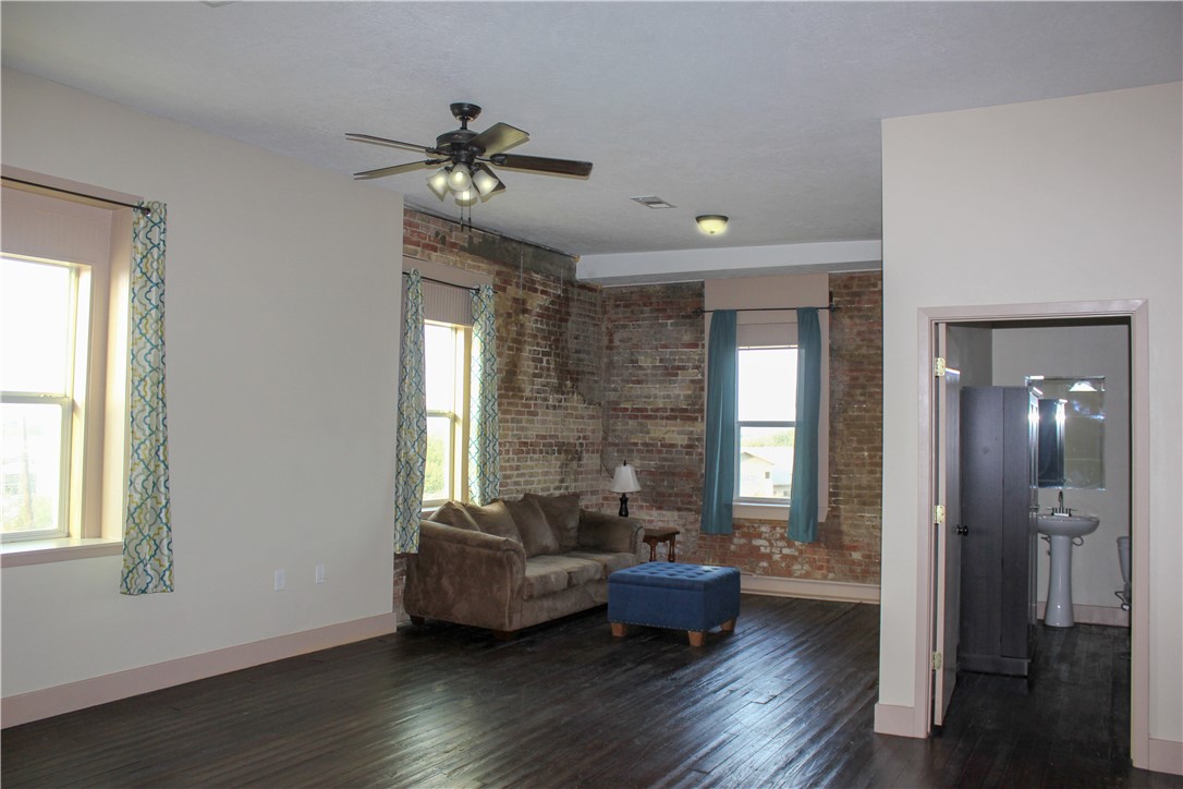 205 South Main Street Caldwell, TX 77836 - Photo 5 of 12 a living room with furniture and a window