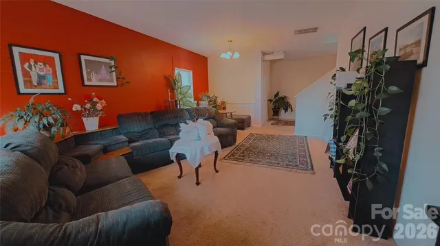 a living room with furniture plant and a potted plant