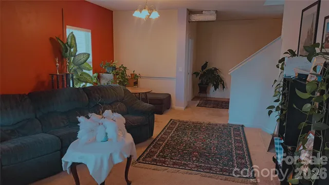 a living room with furniture and a rug