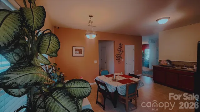 a dining room with a table and chairs