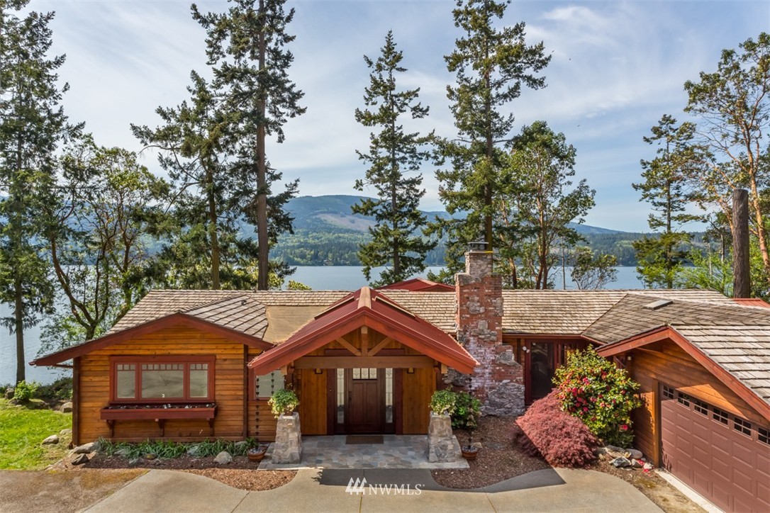1485 East Sequim Bay Road Sequim, WA 98382 - Photo 1 of 25 a front view of a house with a garden