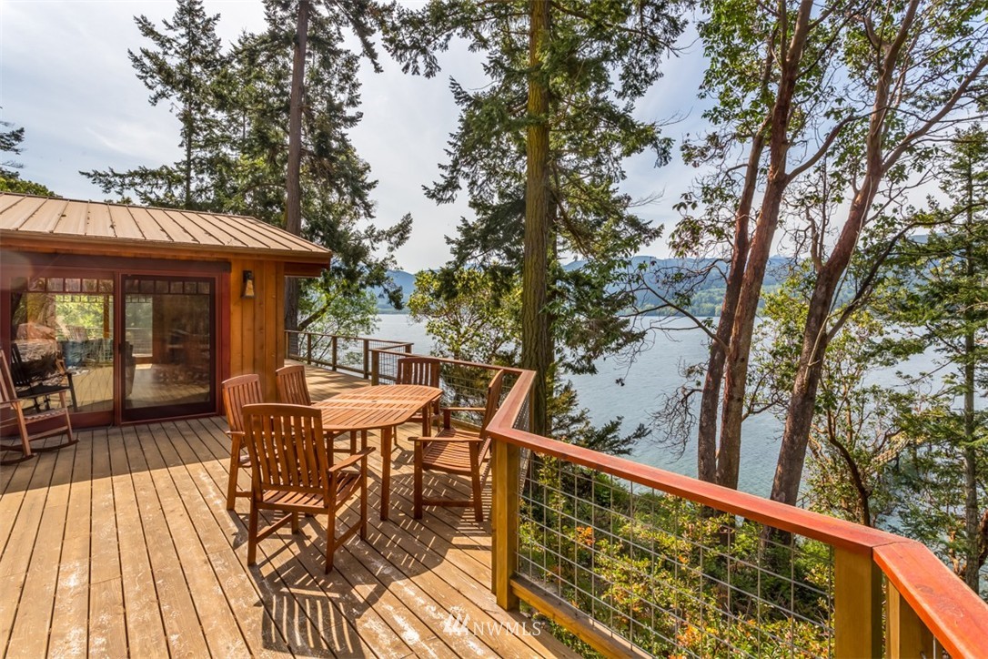 1485 East Sequim Bay Road Sequim, WA 98382 - Photo 12 of 25 a view of a chairs and table on the deck