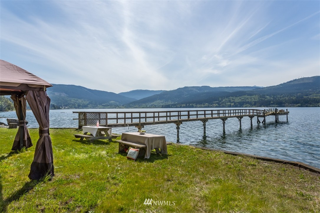 1485 East Sequim Bay Road Sequim, WA 98382 - Photo 3 of 25 a view of a swimming pool with lounge chairs