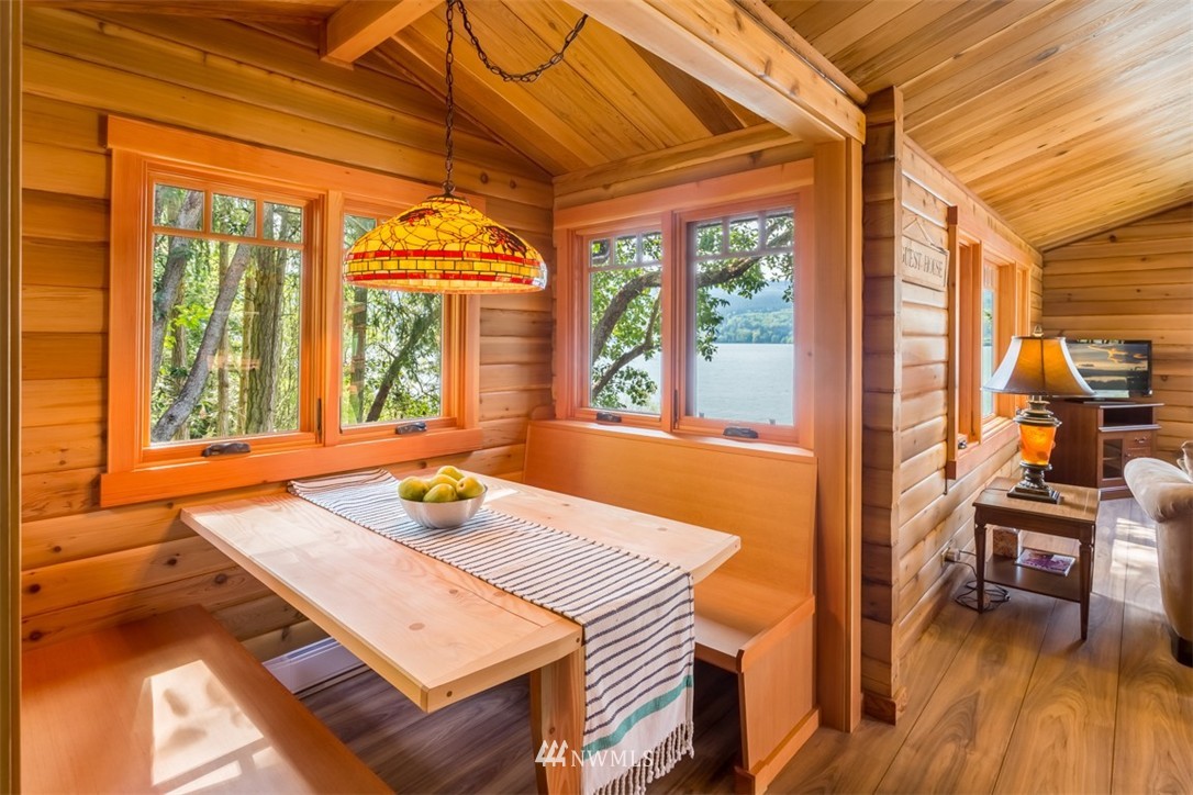 1485 East Sequim Bay Road Sequim, WA 98382 - Photo 21 of 25 a view of a dining room with furniture a chandelier and wooden floor