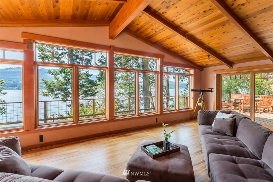 1485 East Sequim Bay Road Sequim, WA 98382 - Photo 5 of 25 a living room with furniture and floor to ceiling windows
