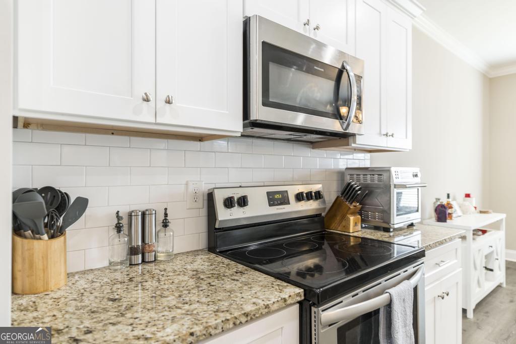 100 Sutter Butte Place Bonaire, GA 31005 - Photo 11 of 34 Granite countertops provide beauty and durability.