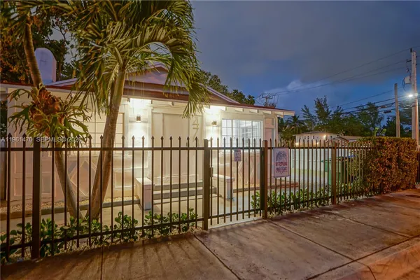 a view of a wrought iron fences in front of house