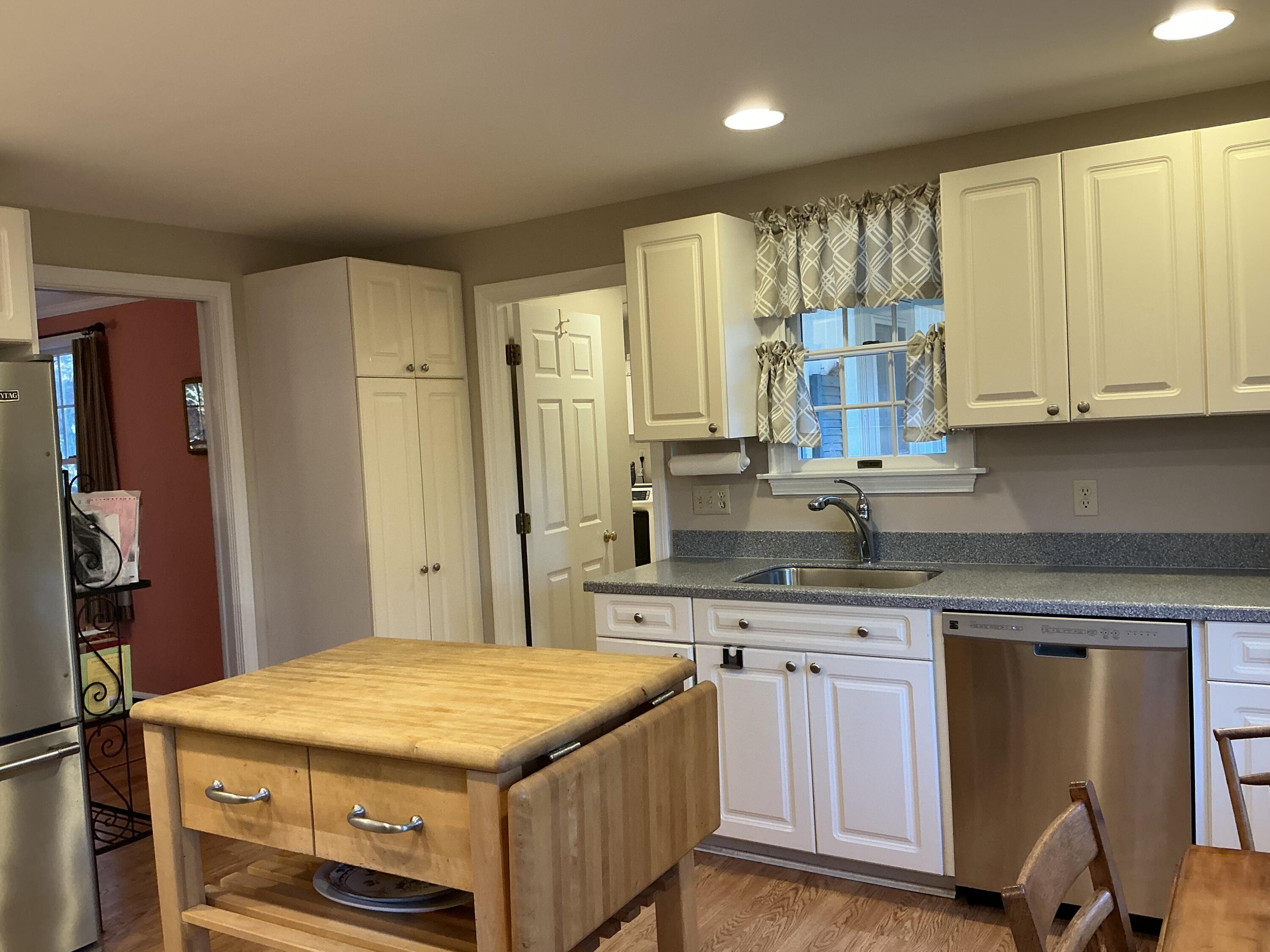 544 Cotuit Road Marstons Mills, MA 02648 - Photo 12 of 52 a kitchen with stainless steel appliances granite countertop a sink and cabinets