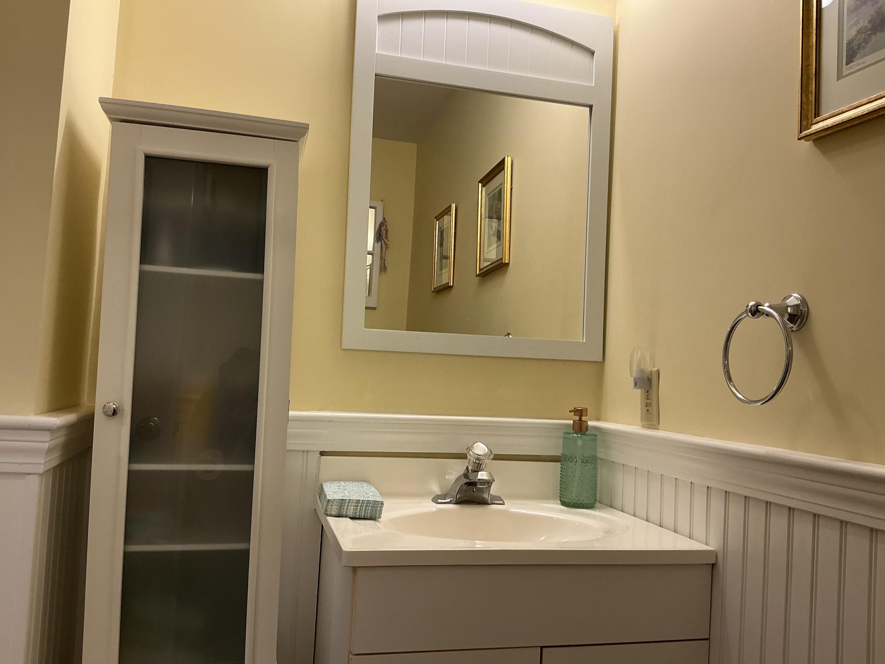 544 Cotuit Road Marstons Mills, MA 02648 - Photo 18 of 52 a bathroom with a sink and mirror