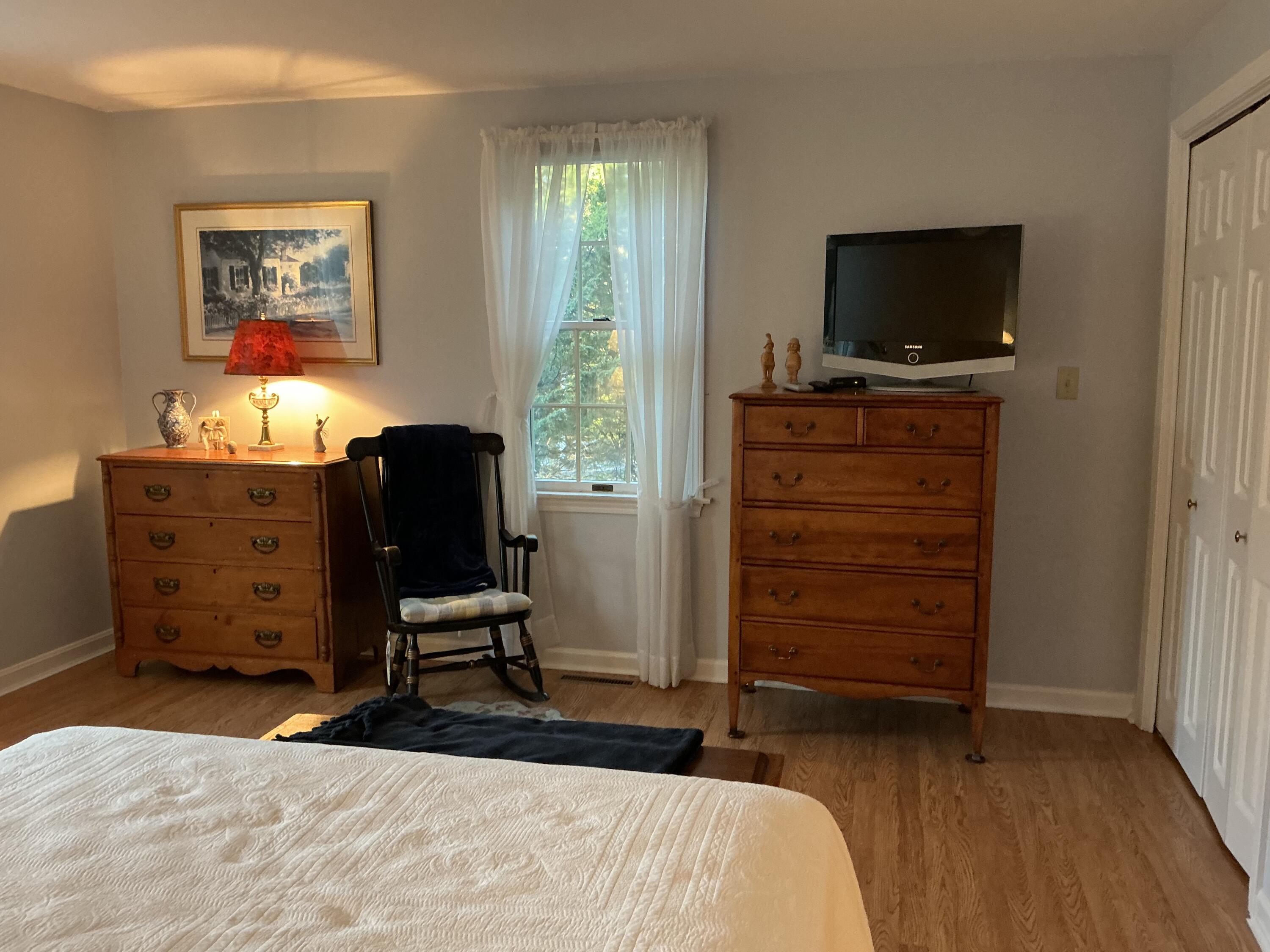 544 Cotuit Road Marstons Mills, MA 02648 - Photo 20 of 52 a bedroom with a bed and furniture