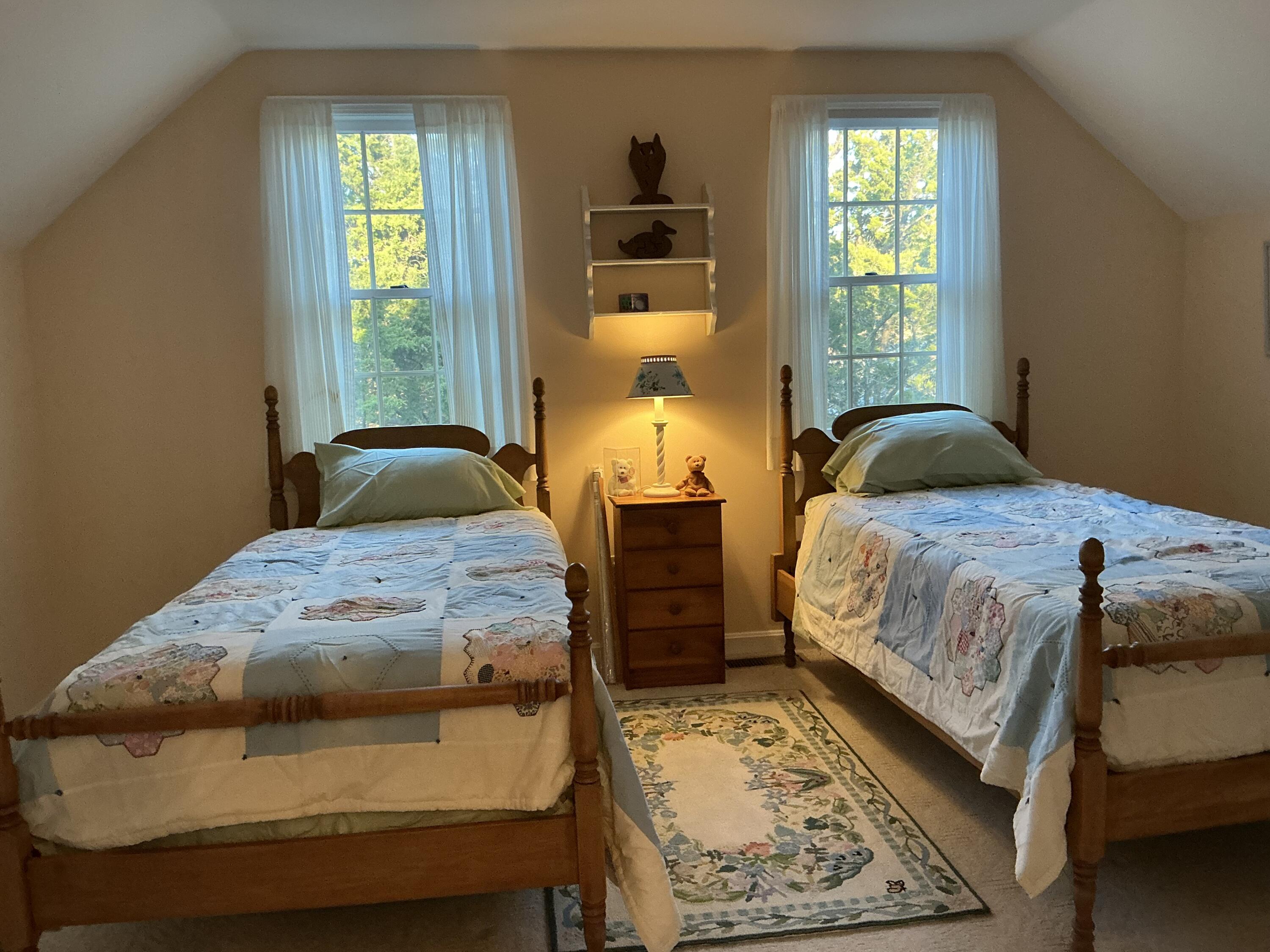 544 Cotuit Road Marstons Mills, MA 02648 - Photo 27 of 52 a bedroom with a bed and wooden floor