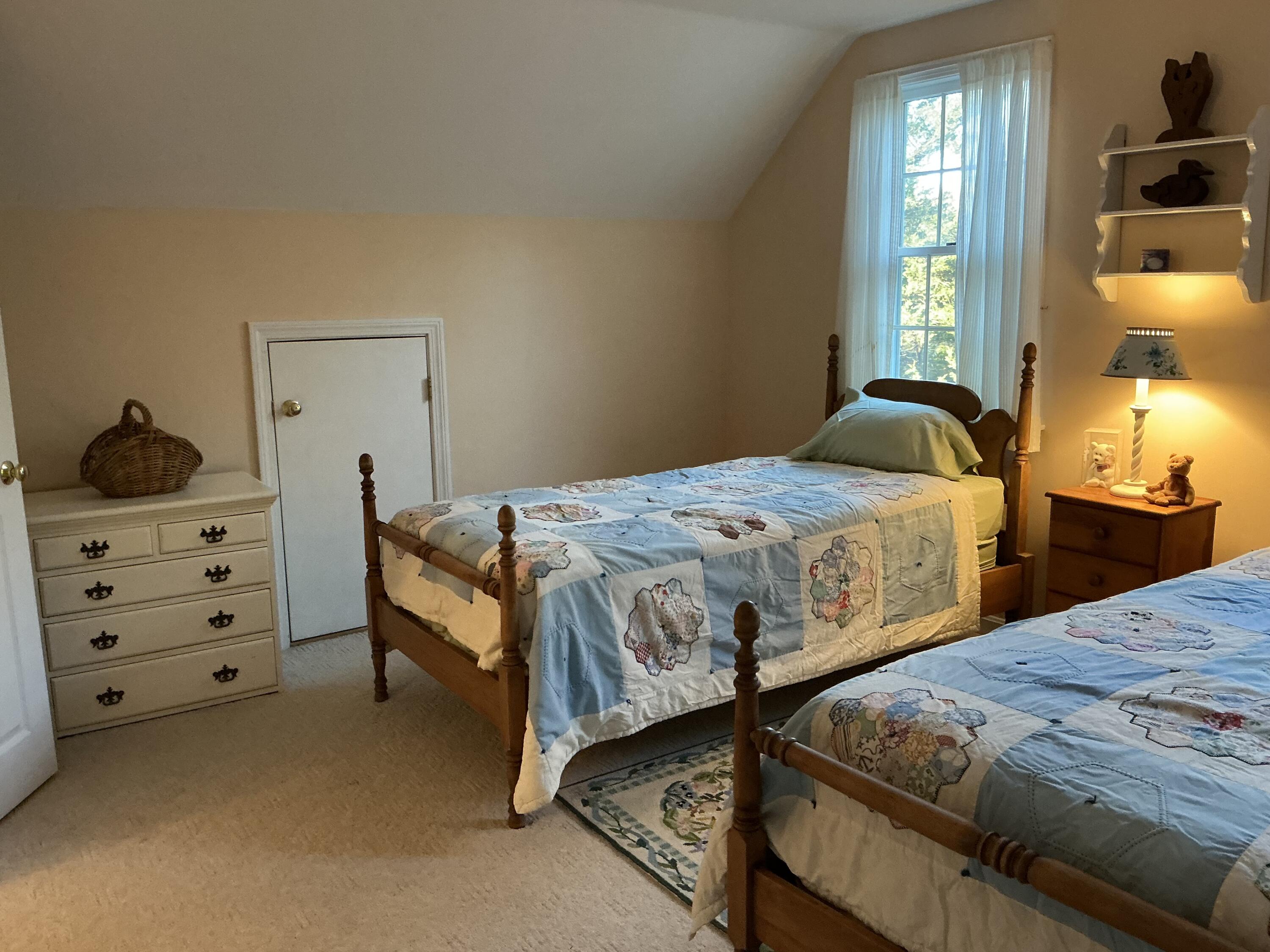 544 Cotuit Road Marstons Mills, MA 02648 - Photo 28 of 52 a bedroom with two beds and dresser with mirror