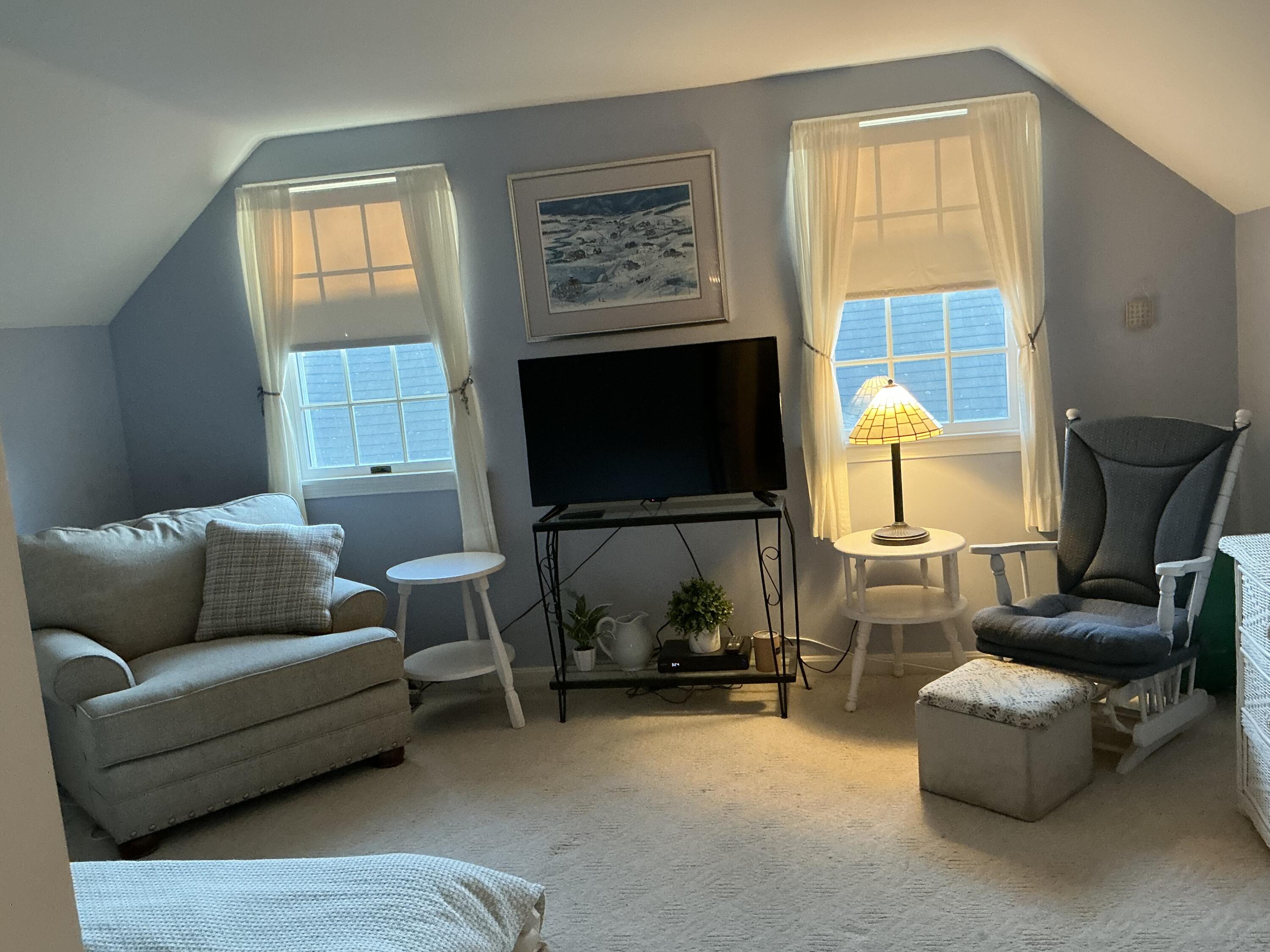 544 Cotuit Road Marstons Mills, MA 02648 - Photo 30 of 52 a living room with furniture a flat screen tv and a window