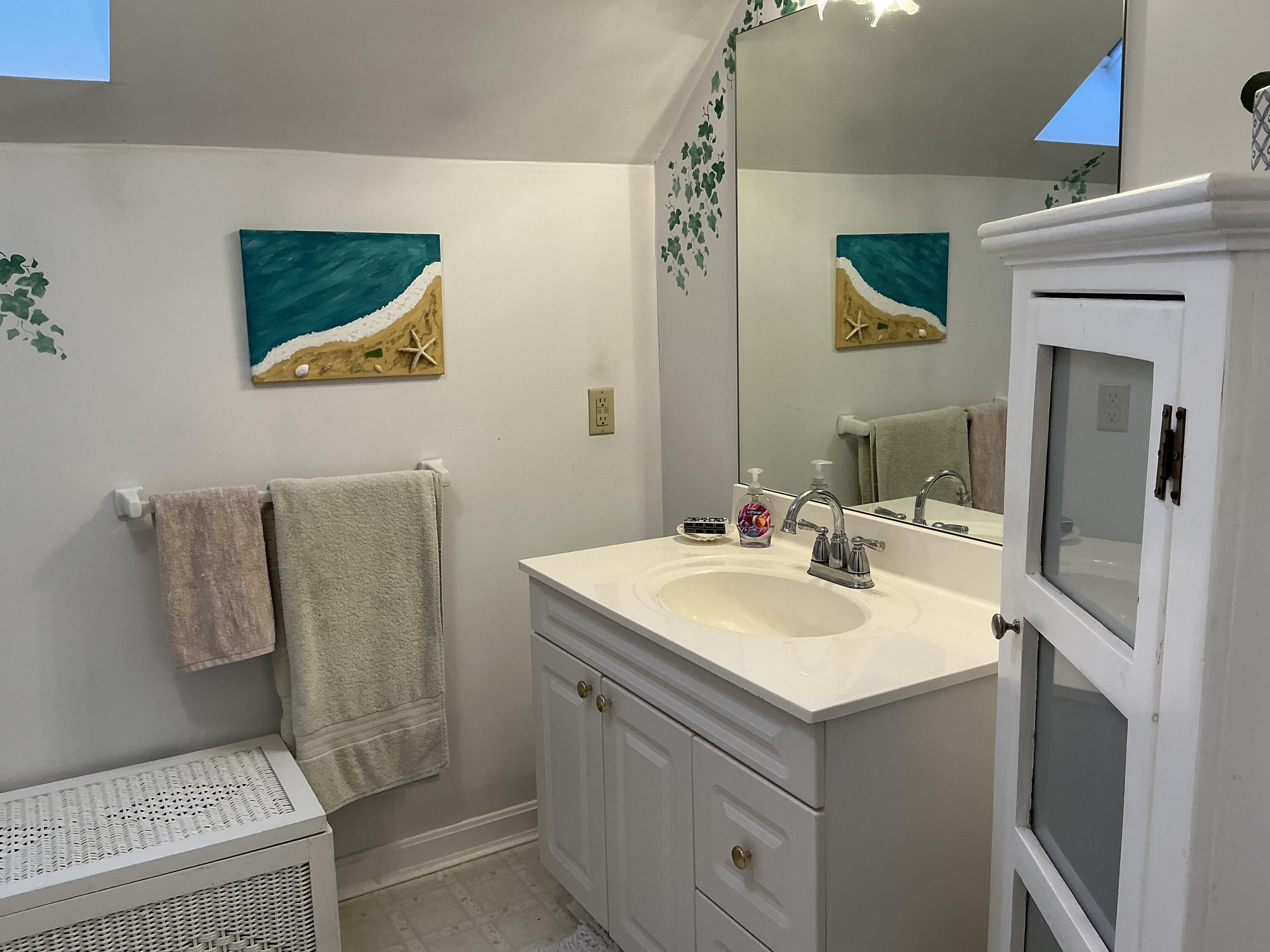 544 Cotuit Road Marstons Mills, MA 02648 - Photo 33 of 52 a bathroom with a sink and a mirror