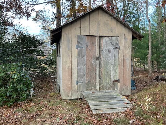 544 Cotuit Road Marstons Mills, MA 02648 - Photo 47 of 52 a small barn with a small yard next to a road