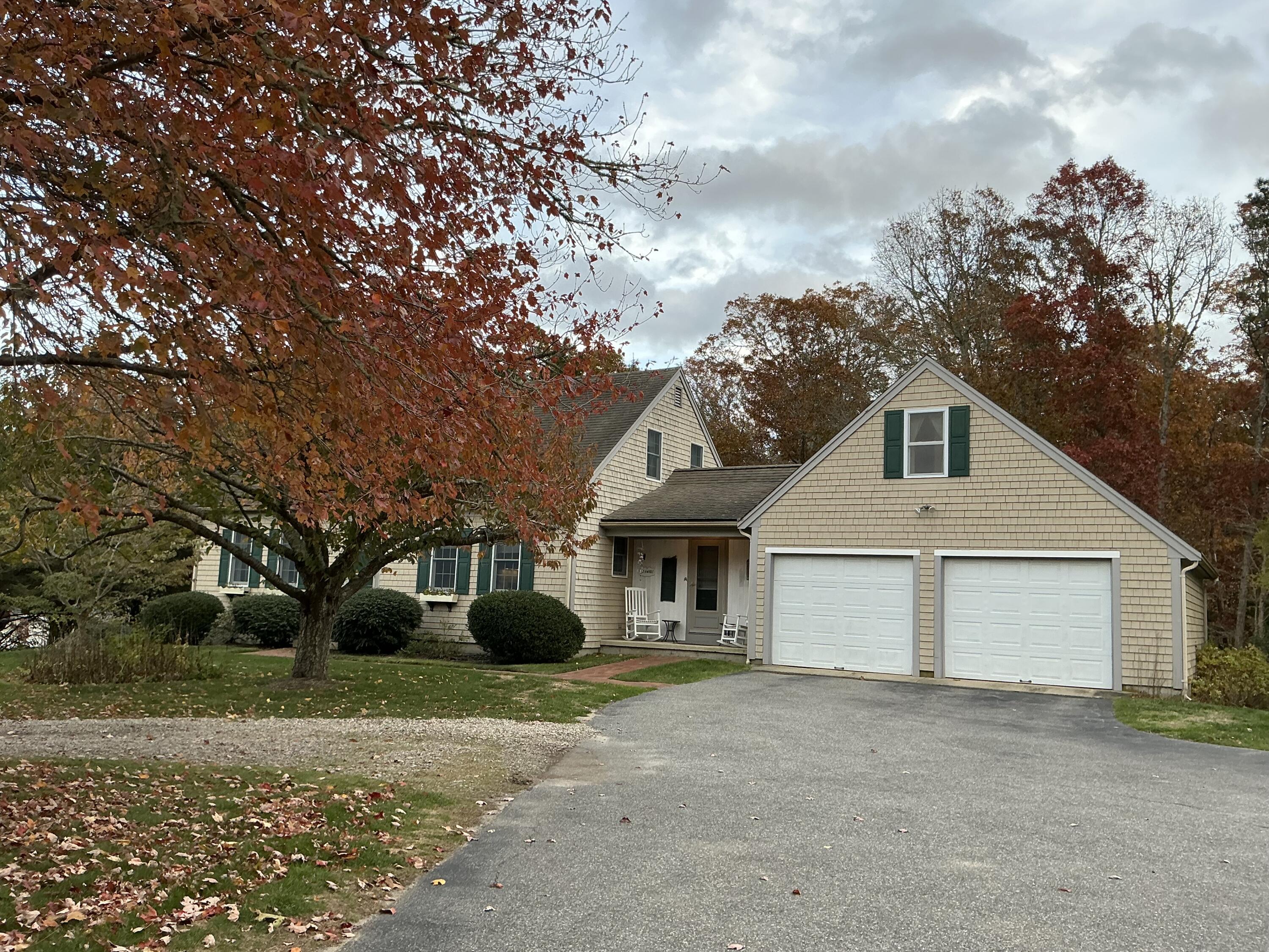 544 Cotuit Road Marstons Mills, MA 02648 - Photo 50 of 52 a front view of a house with a garden