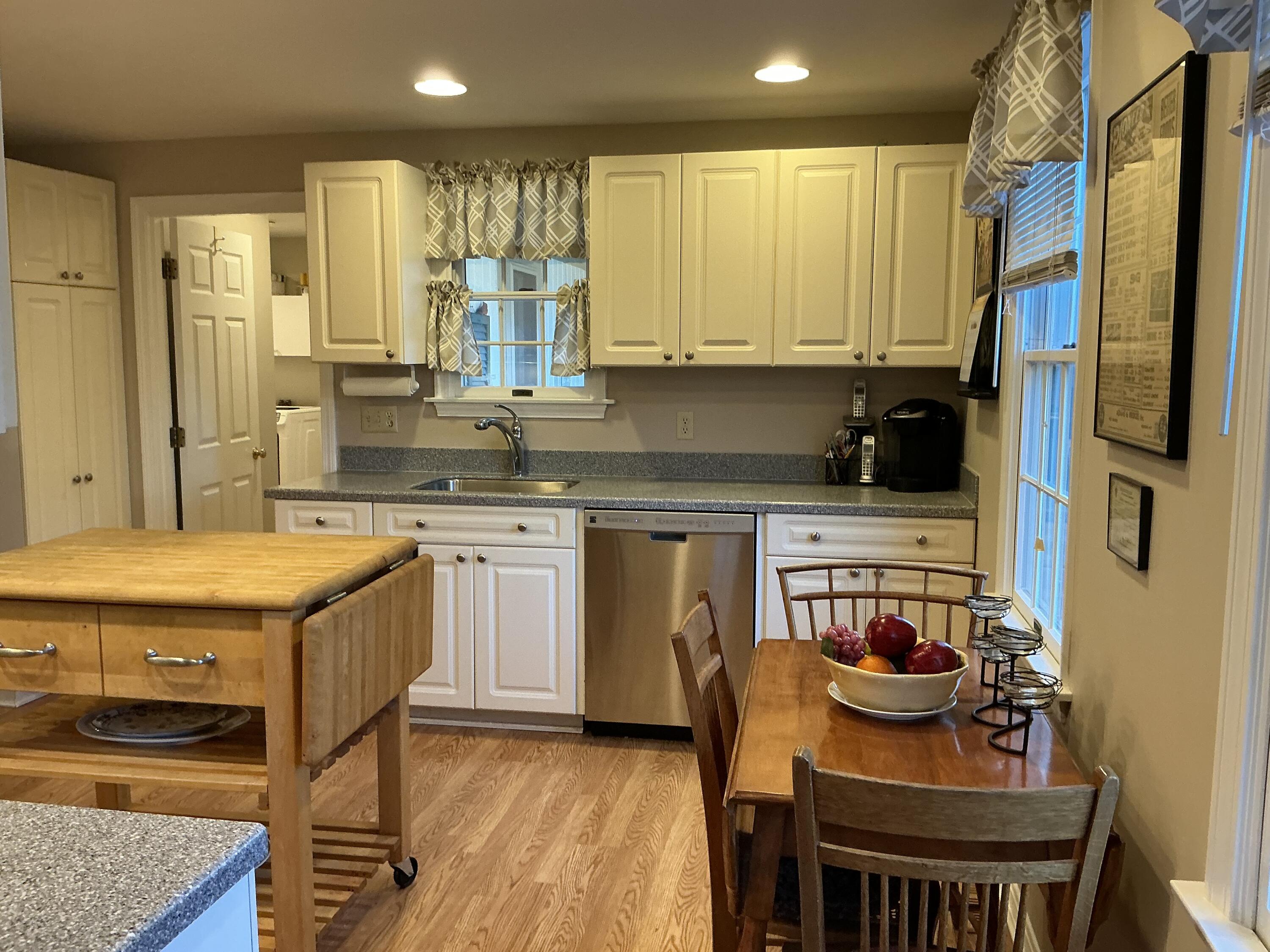 544 Cotuit Road Marstons Mills, MA 02648 - Photo 6 of 52 a kitchen with stainless steel appliances granite countertop a stove a sink dishwasher and a refrigerator