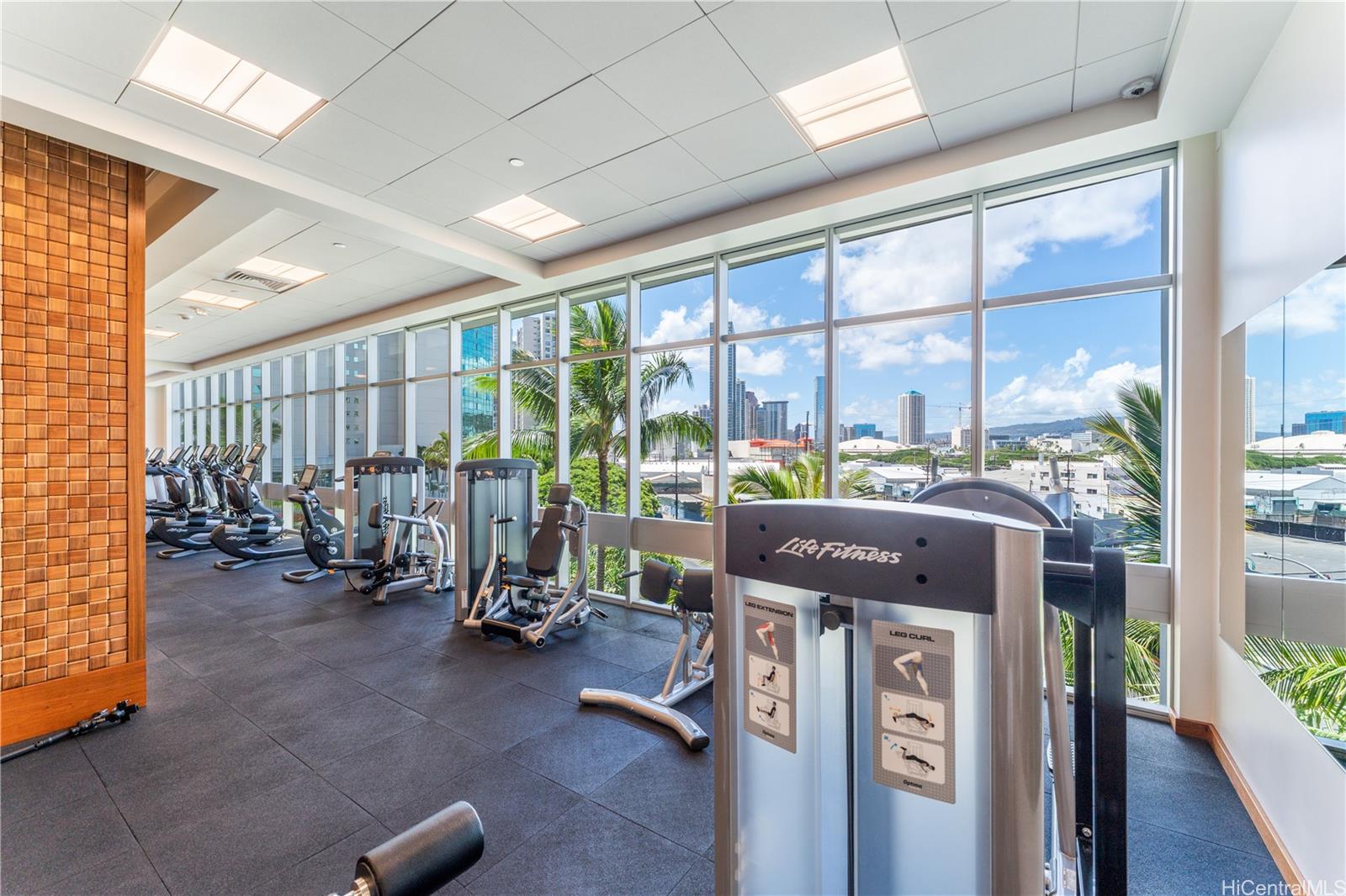 1189 Waimanu Street, Unit 2204 Honolulu, HI 96814 - Photo 15 of 17 a view of a room with gym equipment