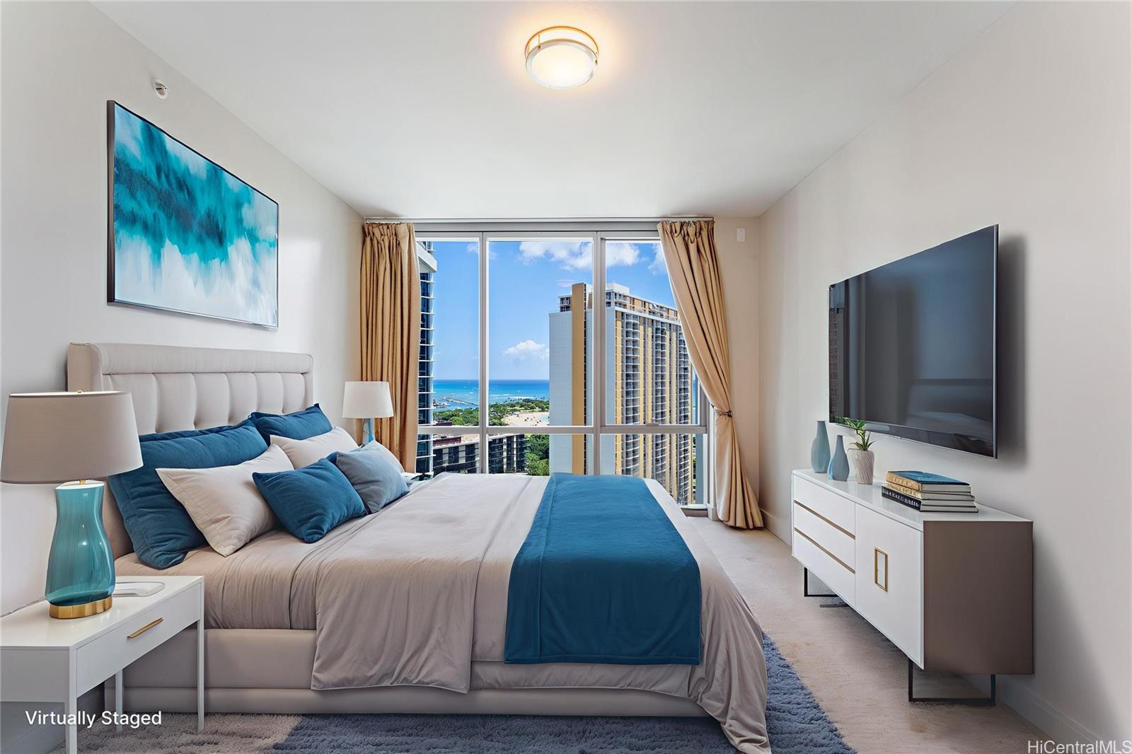 1189 Waimanu Street, Unit 2204 Honolulu, HI 96814 - Photo 5 of 17 a bedroom with a bed and a flat screen tv