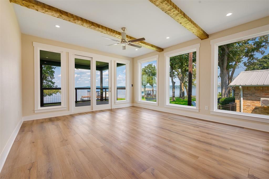 22107 Blue Water Road Chandler, TX 75758 - Photo 17 of 40 wooden floor in an empty room with a window