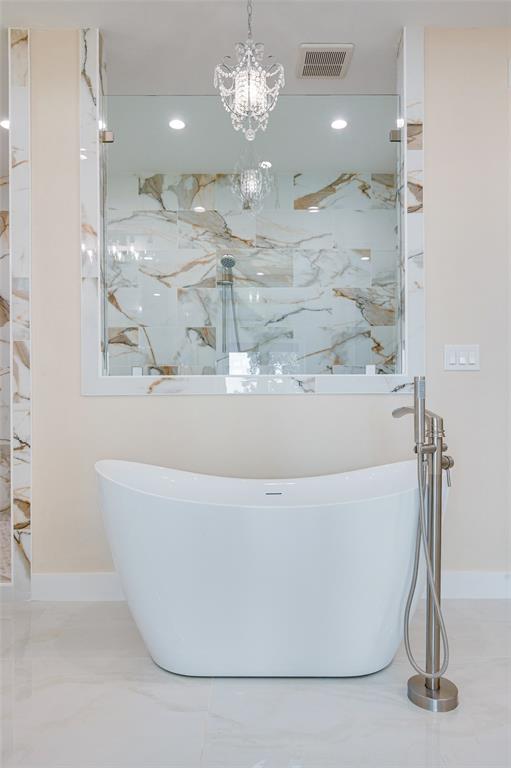 22107 Blue Water Road Chandler, TX 75758 - Photo 19 of 40 a large tub sitting in a bathroom