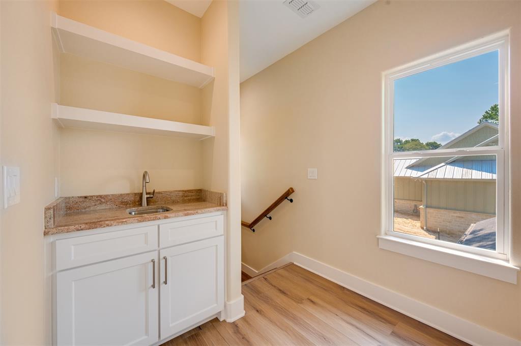 22107 Blue Water Road Chandler, TX 75758 - Photo 21 of 40 a room with a sink and a window