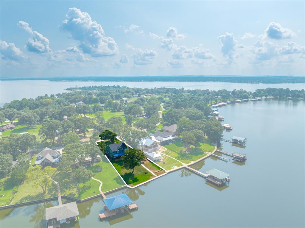 22107 Blue Water Road Chandler, TX 75758 - Photo 34 of 40 an aerial view of residential houses with outdoor space