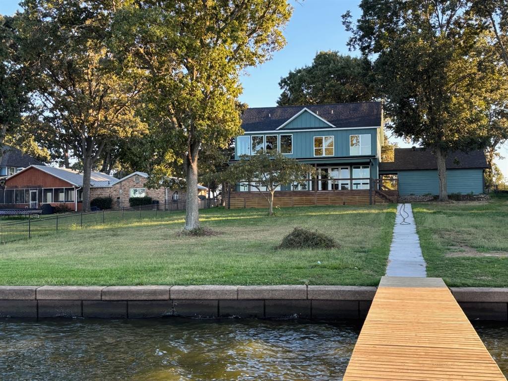 22107 Blue Water Road Chandler, TX 75758 - Photo 37 of 40 a front view of a house with a yard