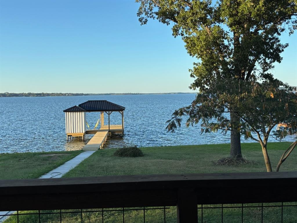 22107 Blue Water Road Chandler, TX 75758 - Photo 38 of 40 front view of a house with a yard