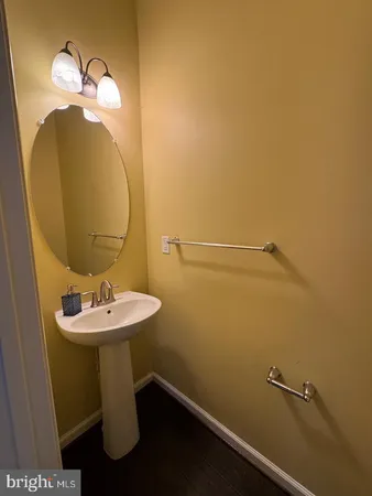 a bathroom with a sink and mirror