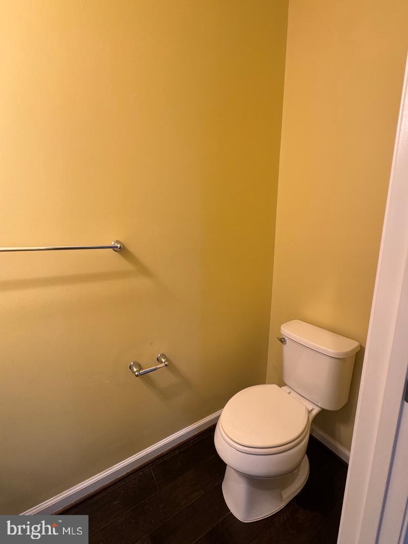 7925 Alchemy Way Elkridge, MD 21075 - Photo 13 of 46 a white toilet sitting next to a white wall