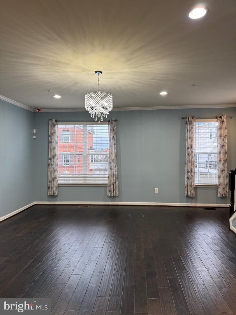 7925 Alchemy Way Elkridge, MD 21075 - Photo 14 of 46 an empty room with wooden floor and windows