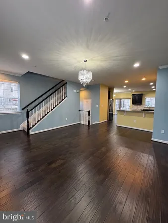 a view of a kitchen with a dishwasher cabinets and wooden floor