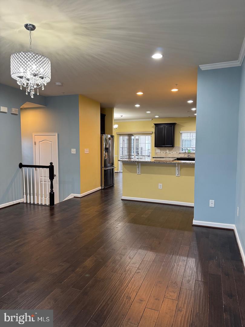 7925 Alchemy Way Elkridge, MD 21075 - Photo 19 of 46 a view of a kitchen with a dishwasher cabinets and wooden floor
