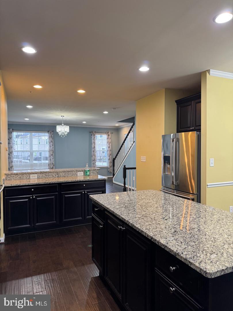 7925 Alchemy Way Elkridge, MD 21075 - Photo 22 of 46 a kitchen with stainless steel appliances granite countertop sink stove and refrigerator