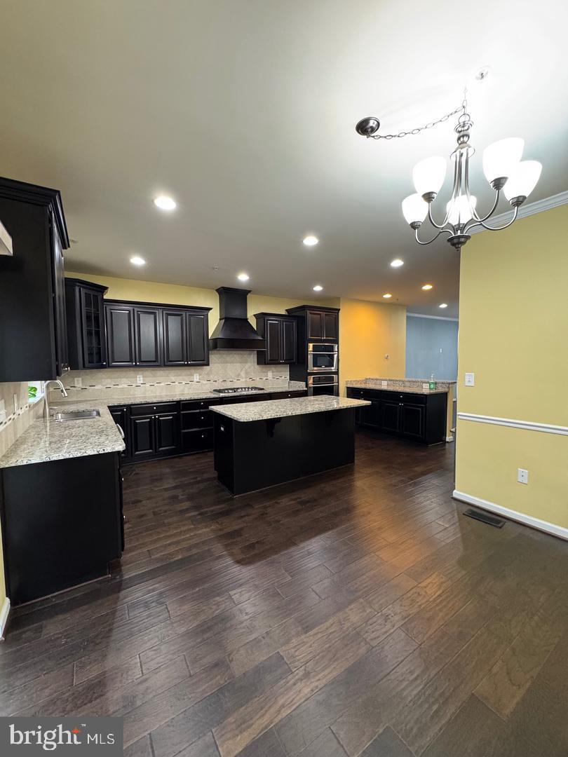7925 Alchemy Way Elkridge, MD 21075 - Photo 23 of 46 a large kitchen with a large counter top appliances and cabinets