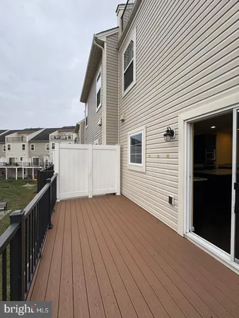 a view of a balcony with wooden floor